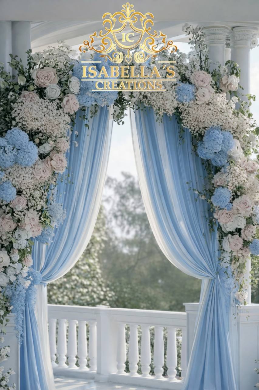 Floral arch with blue hydrangeas pink roses and draping for quinceañera ceremony at Carissa Venue