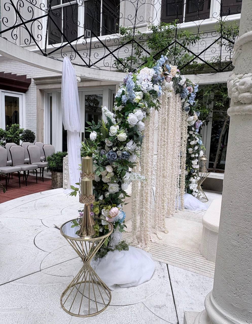 Floral arch with blue hydrangeas at Carissa Venue